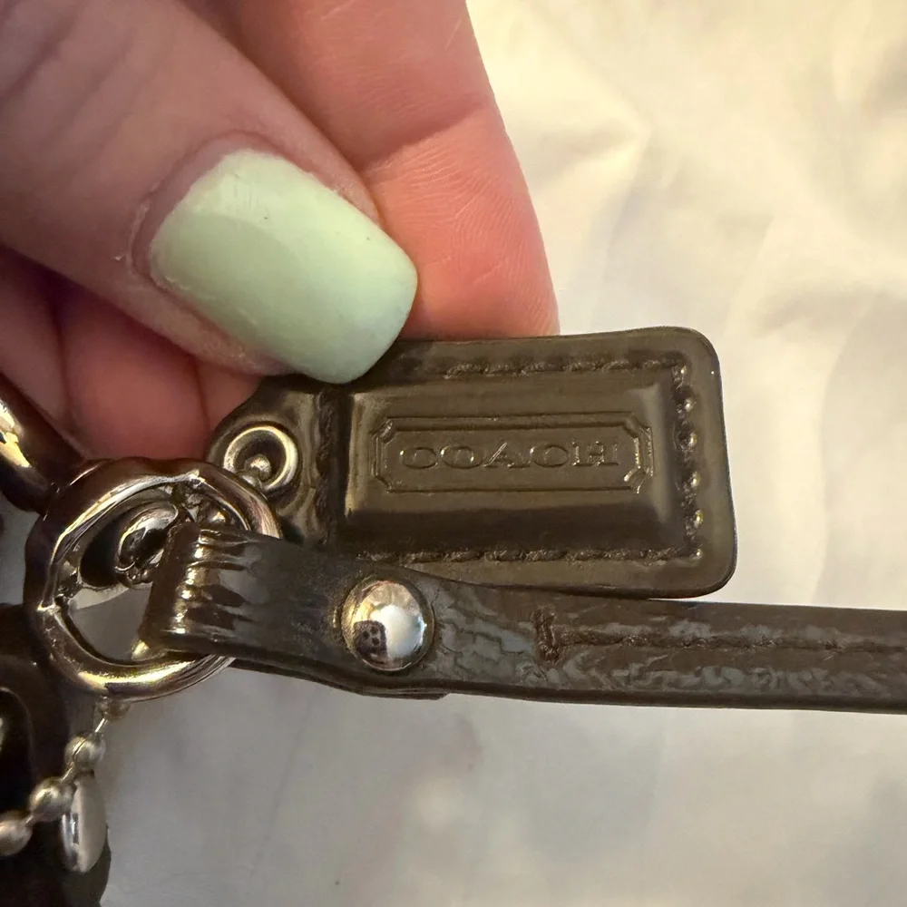 Coach Signature C canvas wristlet.